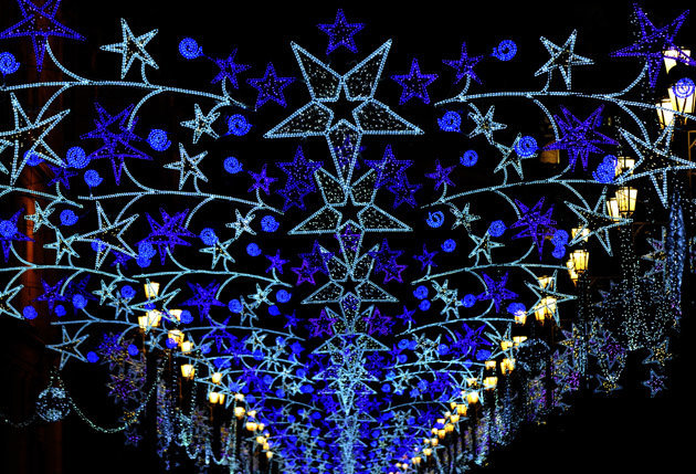 Christmas lights in a street of Sevilla on December 9, 2011. Streets of the capital decorated with lights every year ahead of Christmas celebrations .AFP PHOTO / CRISTINA QUICLER